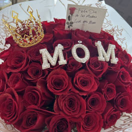 Bouquet of red roses with a gold crown and pearl "MOM" letters