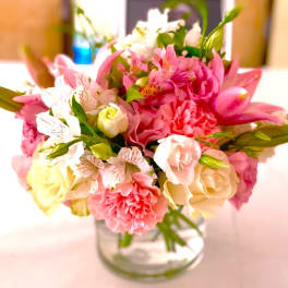Pink and white mixed bouquet in a clear glass vase
