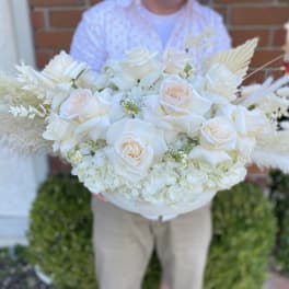 Large white rose bouquet with pale hydrangeas and feathery accents