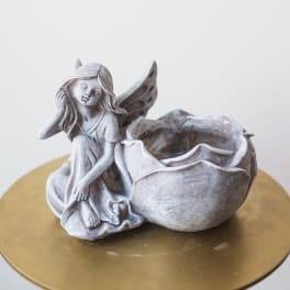 Fairy figurine planter with a flower-shaped bowl