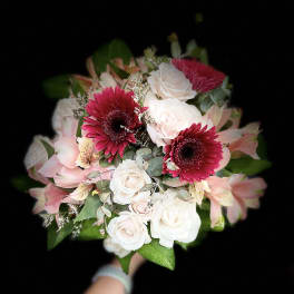 Bouquet of pink gerbera daisies, white roses, and pale pink lilies