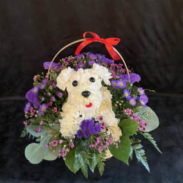 Flower basket shaped like a white dog with purple and pink blooms