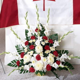 Red and white floral standing spray with lilies and carnations
