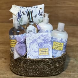Lavender chamomile bath gift basket with bottles, soap, and a sachet