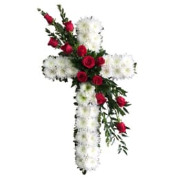 Cross-shaped floral arrangement with red roses and white chrysanthemums