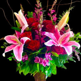 Pink lilies and red roses in a vase