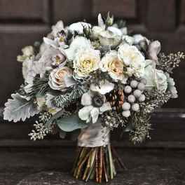White and cream bridal bouquet with roses and orchids