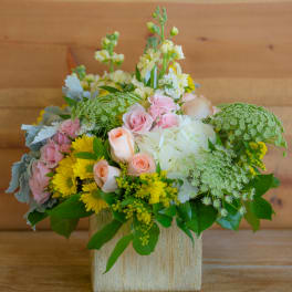 Mixed pastel bouquet in a square gold vase