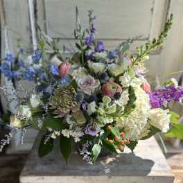 Mixed bouquet with blue, white, pink, and purple flowers