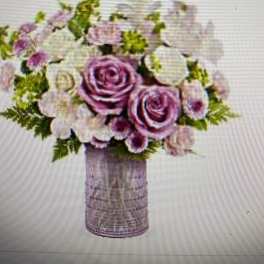 Bouquet of pink and white roses in a glass vase