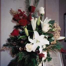 Tall floral standing spray with white lilies and red roses
