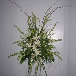 Tall white floral standing spray with long arching stems