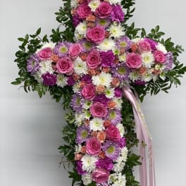 Cross-shaped floral spray with pink roses and white daisies