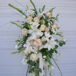 Tall white and blush floral spray on a stand