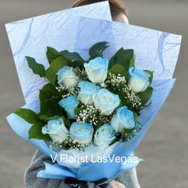 Bouquet of light blue and white roses with baby's breath