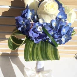 Blue hydrangea bouquet with white roses and striped leaves