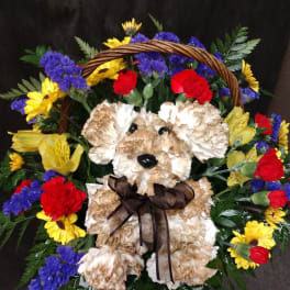 Teddy bear made of flowers in a basket with colorful blooms