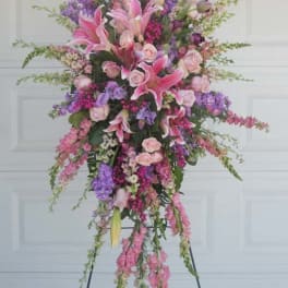 Tall pink and purple floral spray on a stand