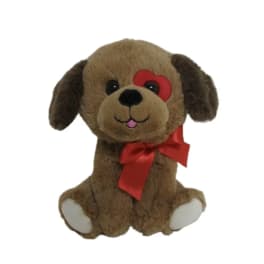 Brown plush dog with a red ribbon and heart-shaped eye patch