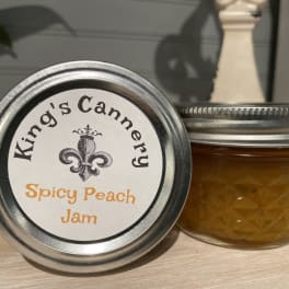 Two jars of spicy peach jam with silver lids