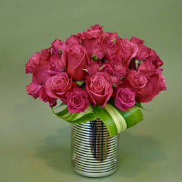 Pink rose bouquet in a striped silver vase