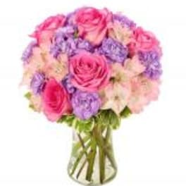 Pink and lavender bouquet in a clear glass vase