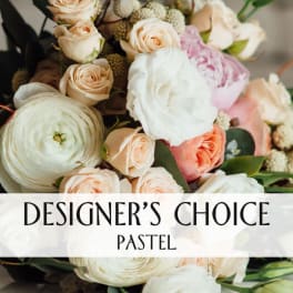 Pastel bouquet of roses, peonies, and ranunculus with a designer's choice label