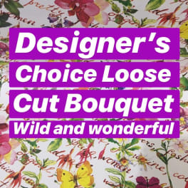 Floral-patterned wrapping paper with purple labels reading Designer's Choice Loose Cut Bouquet