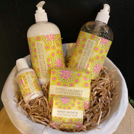 Gift basket with lemon verbena bath products in a white bowl