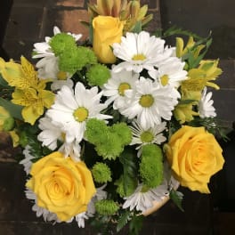 Bouquet of yellow roses, white daisies, and green pompons