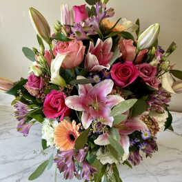 Mixed bouquet with pink lilies, roses, and gerbera daisies