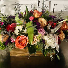 Large mixed bouquet with roses, tulips, and hydrangeas in a box