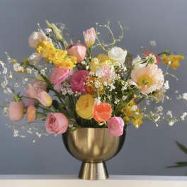 Mixed pastel bouquet in a gold vase