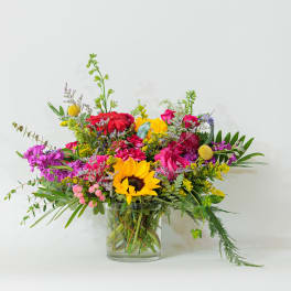 Colorful mixed bouquet in a clear glass vase