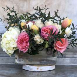 Pink and white roses with hydrangea in a rustic wooden box