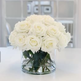 White rose bouquet in a clear glass vase