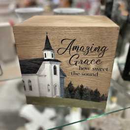 Wooden box with a church illustration and the words "Amazing Grace"