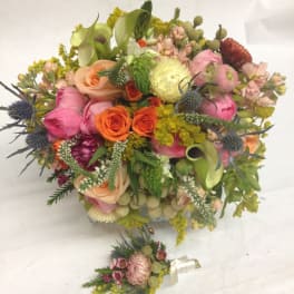 Colorful mixed bouquet with roses, calla lilies, and thistle