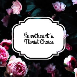Pink roses around a white label reading Sweetheart's Florist Choice