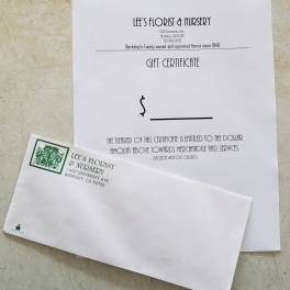 Floral gift certificate and matching envelope from Lee's Florist & Nursery
