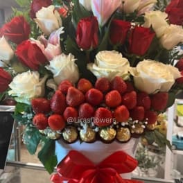 Bouquet of red and white roses with strawberries in a white box