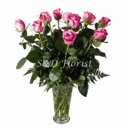 Pink roses in a clear glass vase