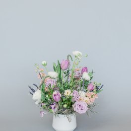 Lavender and white mixed bouquet in a white vase