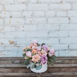 Small pastel bouquet in a white round box