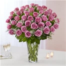 Bouquet of pink roses in a clear glass vase