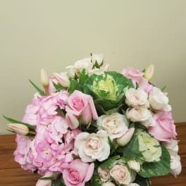 Pink and white rose bouquet with hydrangeas and tulip buds