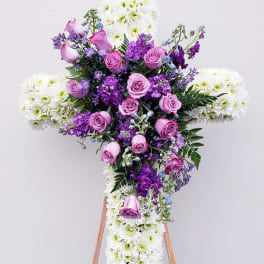 Cross-shaped floral spray with pink roses and white chrysanthemums