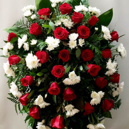 Large standing arrangement of red roses and white daisies