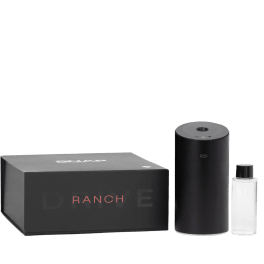 Black diffuser, bottle, and box set on a plain background