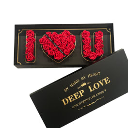 Black gift box with red rose I heart U arrangement and gold lettering on the lid